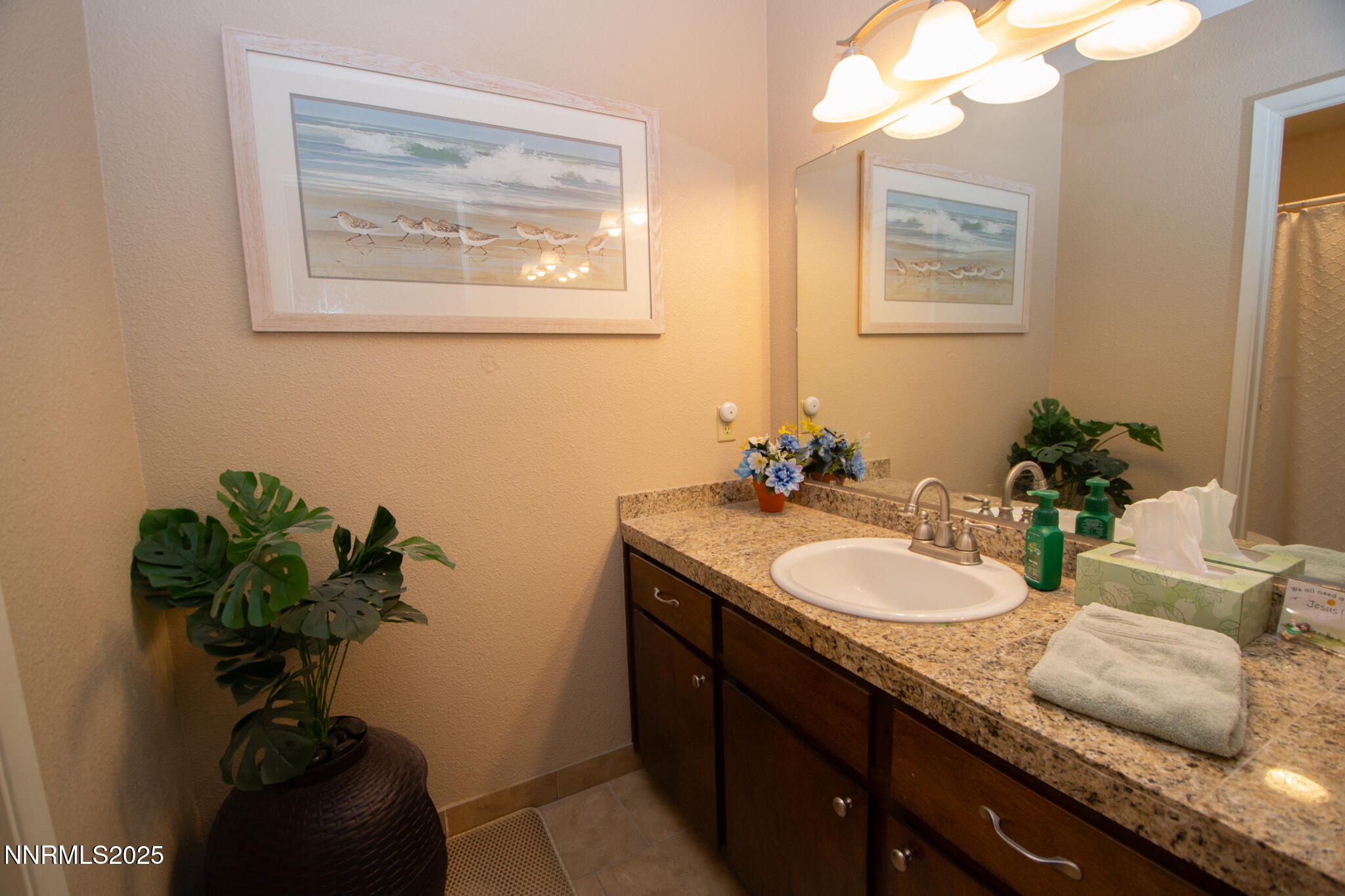 2127 Roundhouse Road Sparks, NV 89431 - Photo 13 of 20 a bathroom with a sink a vanity and a mirror