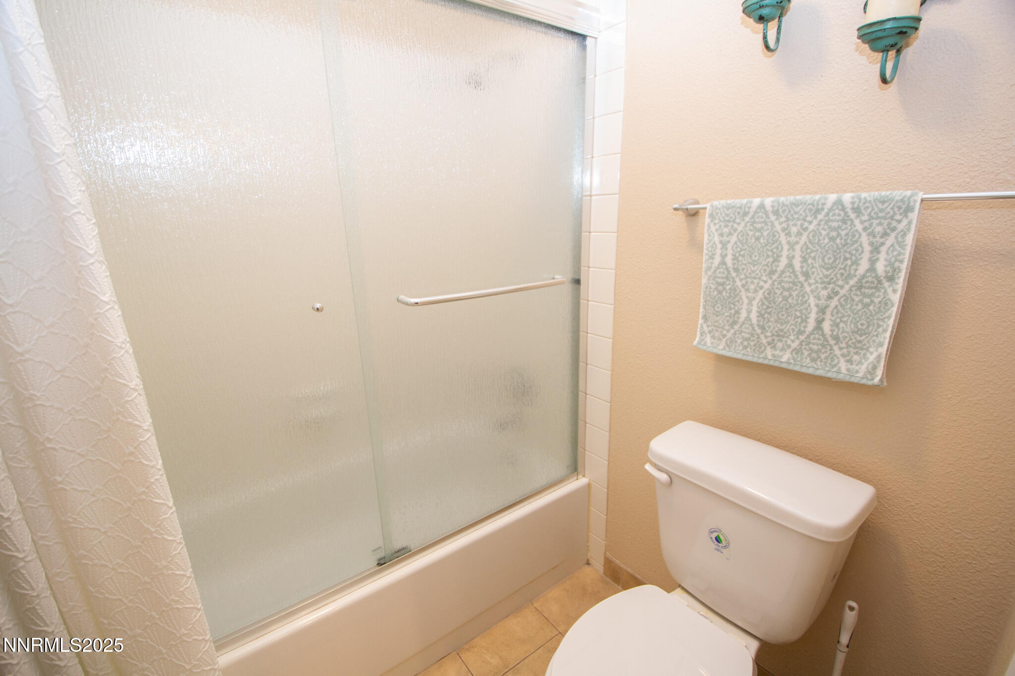 2127 Roundhouse Road Sparks, NV 89431 - Photo 15 of 20 a white toilet sitting next to a bath tub