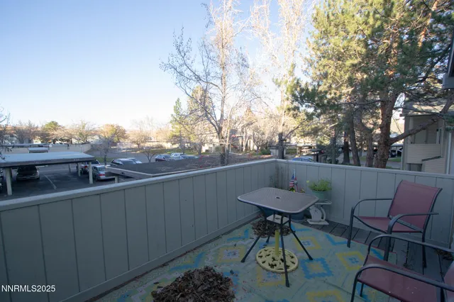 a view of a chairs and table in patio