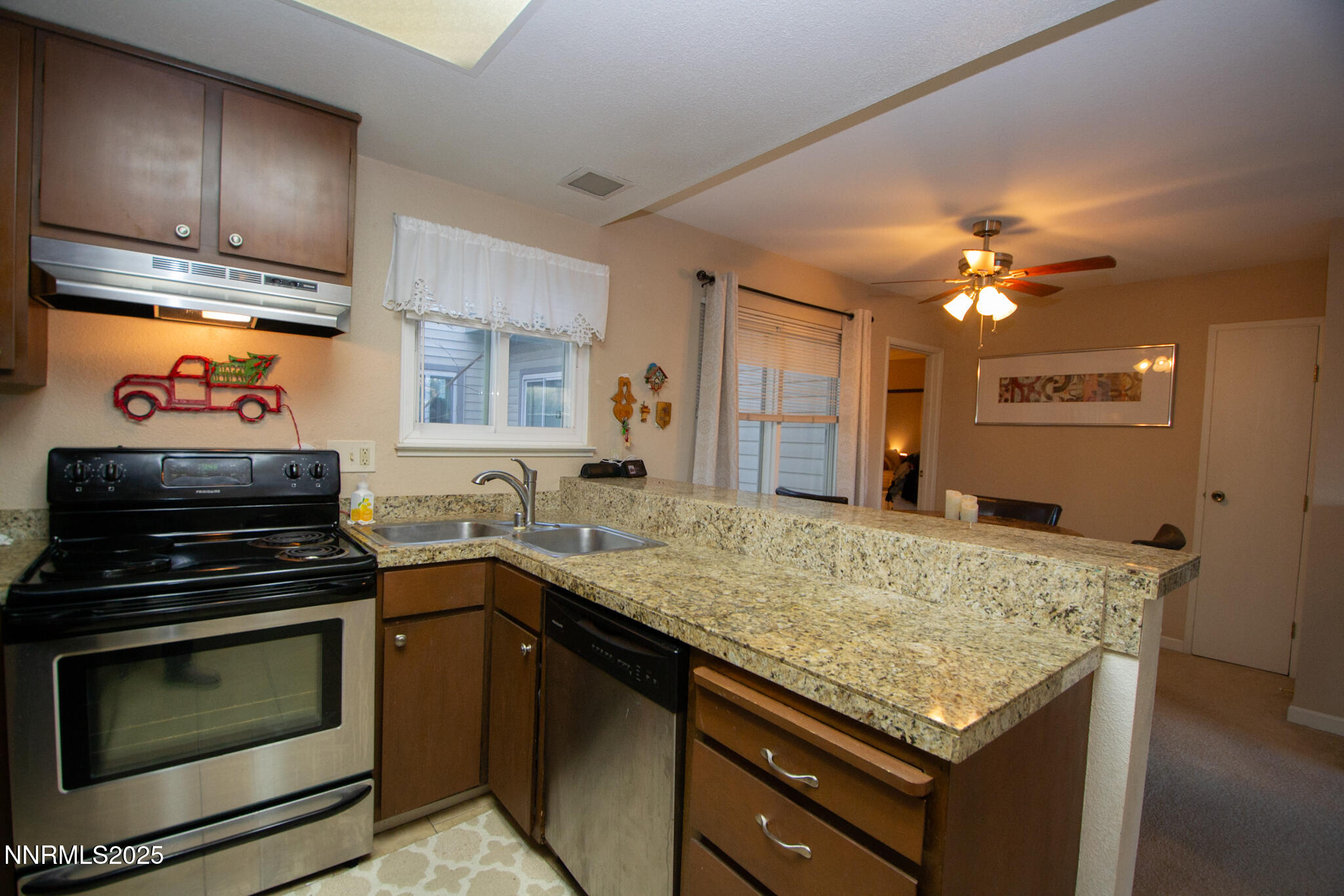2127 Roundhouse Road Sparks, NV 89431 - Photo 9 of 20 a kitchen with a stove and a sink