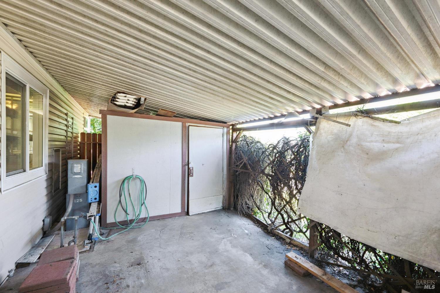 32 Charro Court Santa Rosa, CA 95401 - Photo 31 of 34 Large storage space in carport area.