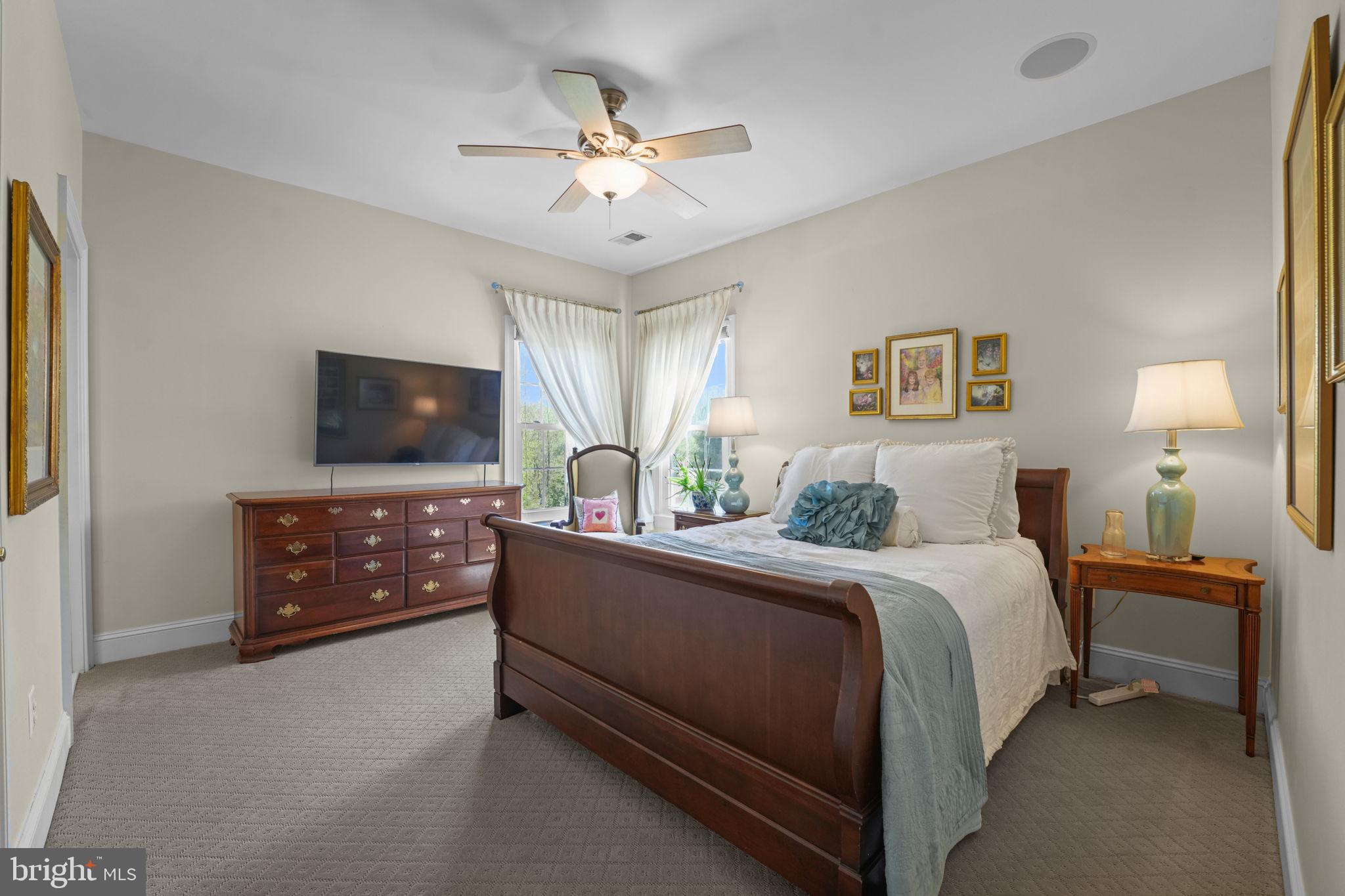 11431 Woolington Road Great Falls, VA 22066 - Photo 27 of 49 a bed room with a bed and a television