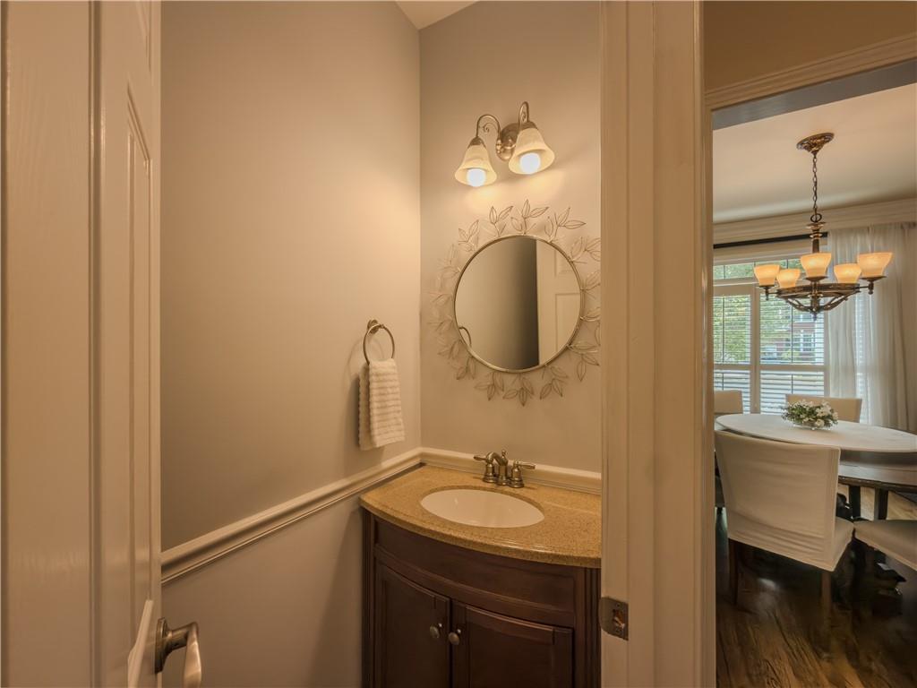 4284 Cedar Bluff Way Southwest Lilburn, GA 30047 - Photo 34 of 62 a bathroom with a sink and a mirror