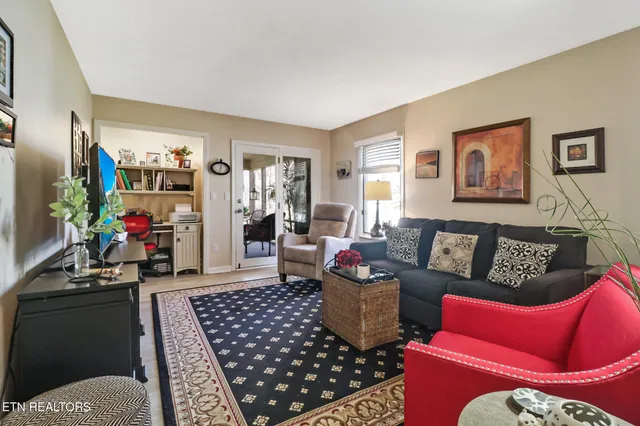 a view of balcony with chairs and wooden fence