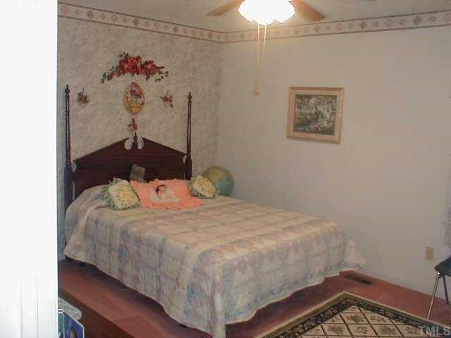 7229 Pilgrim Road Raleigh, NC 27616 - Photo 7 of 10 One of the three bedrooms on the upper level - only 7 steps!