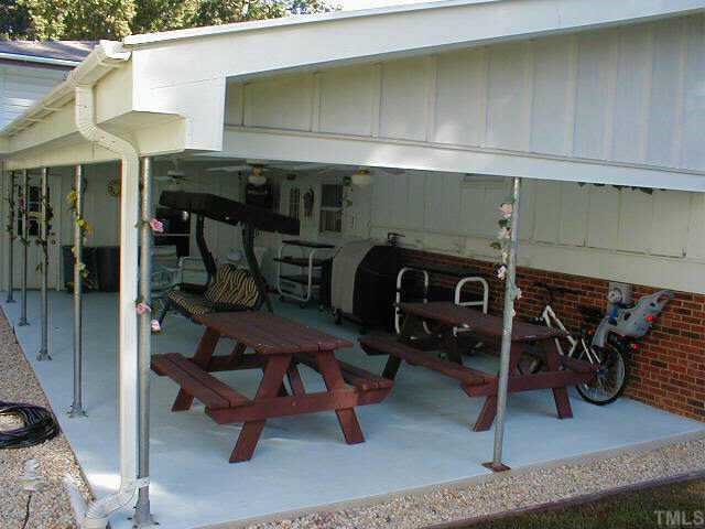 7229 Pilgrim Road Raleigh, NC 27616 - Photo 9 of 10 Check out the awesome covered porch. No worries about the rain!