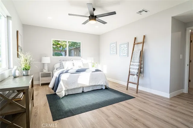 a bed room with a bed furniture and a window