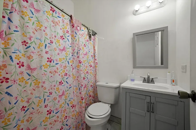 a bathroom with a toilet and a sink