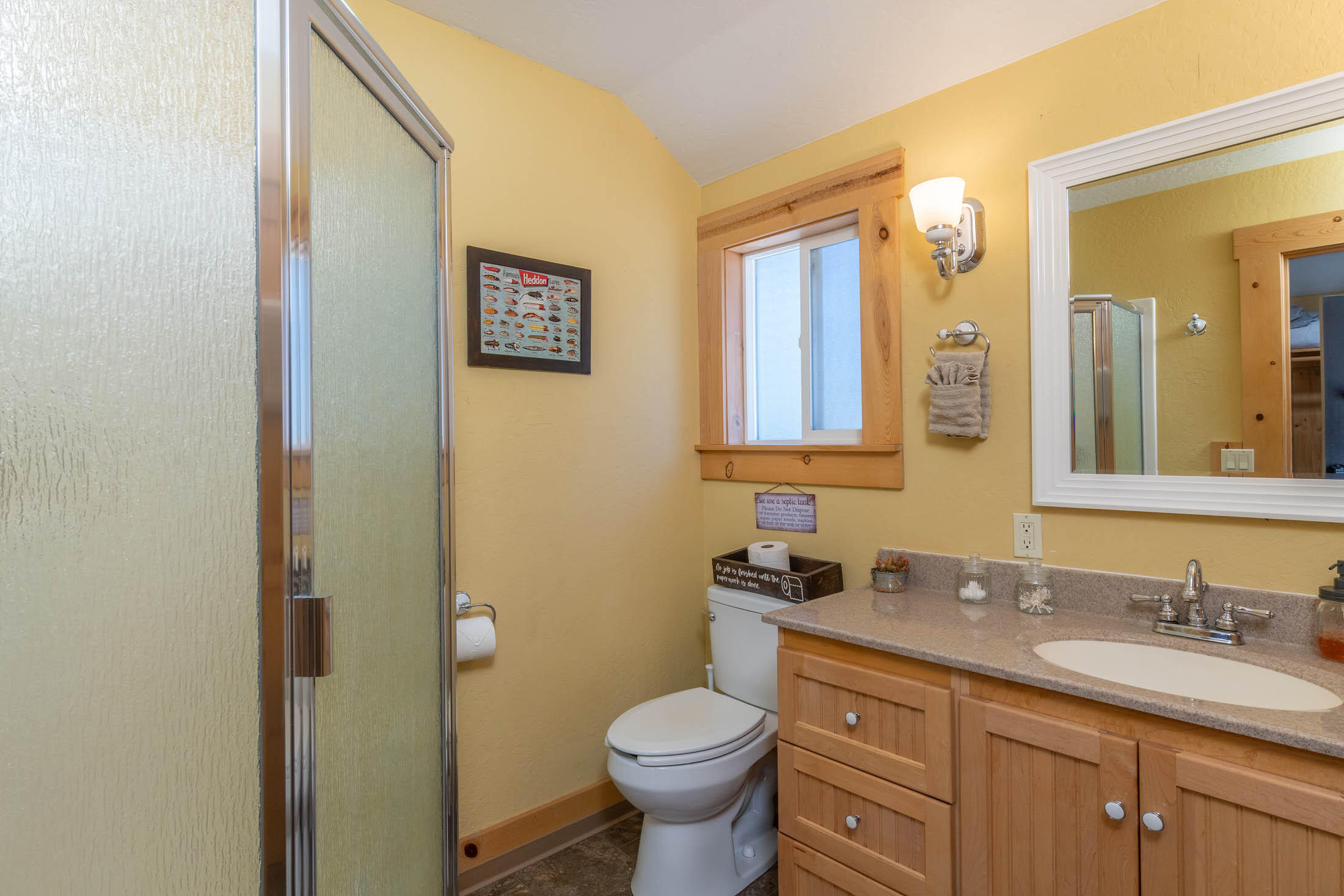 32907 River Bend Road Chiloquin, OR 97624 - Photo 32 of 83 a bathroom with a granite countertop toilet sink and a mirror