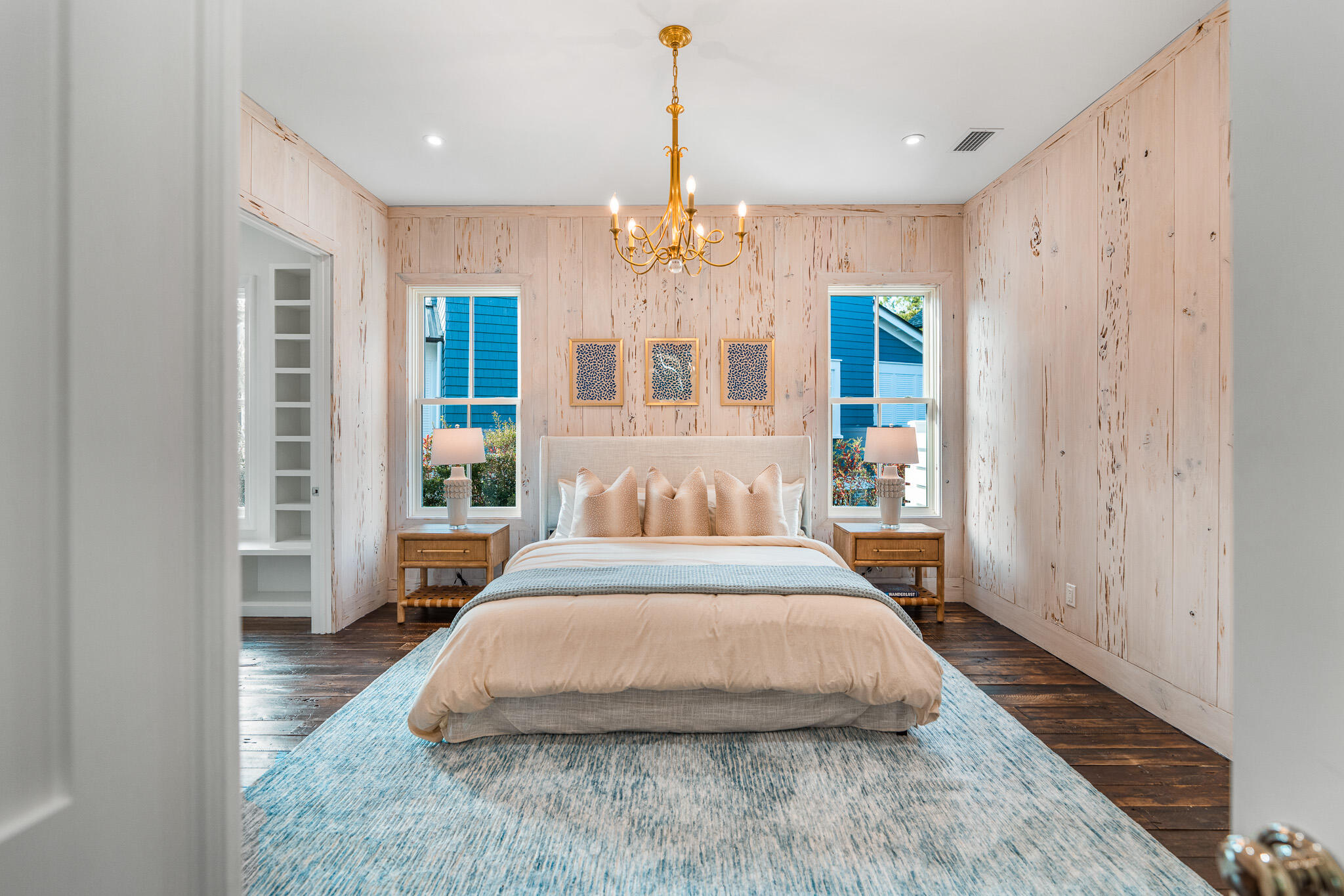 80 Shore Bridge Cir Inlet Beach Inlet Beach, FL 32461 - Photo 20 of 46 a spacious bedroom with a large bed chandelier and a window