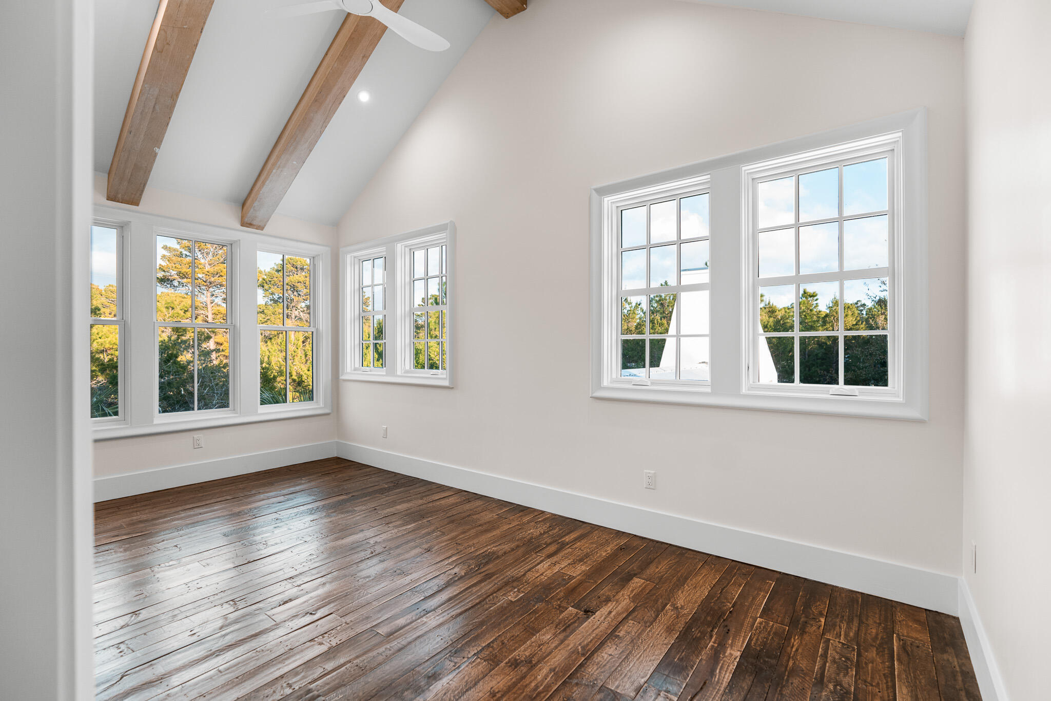 80 Shore Bridge Cir Inlet Beach Inlet Beach, FL 32461 - Photo 31 of 46 a view of an empty room with wooden floor and a window