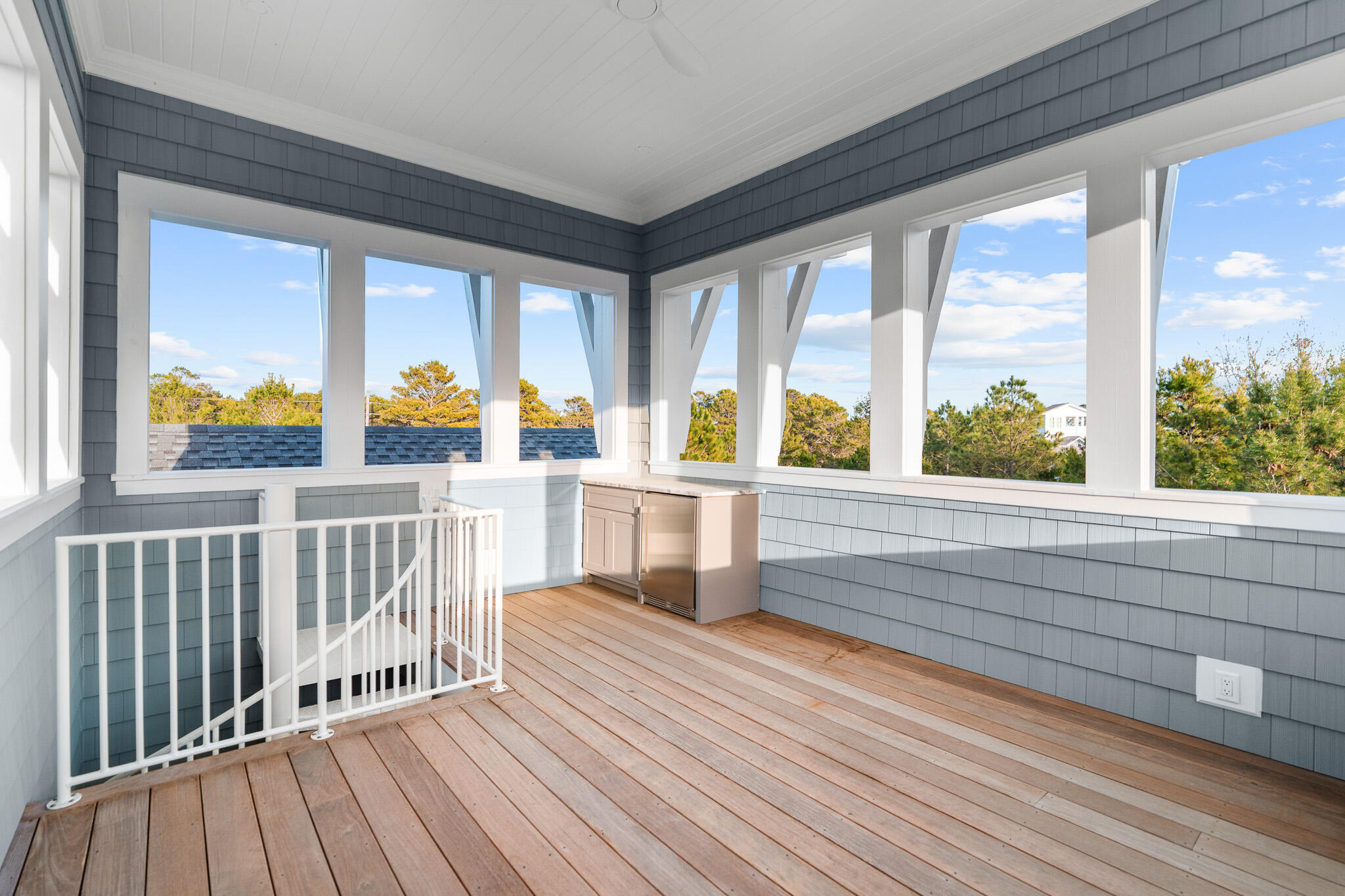 80 Shore Bridge Cir Inlet Beach Inlet Beach, FL 32461 - Photo 40 of 46 a view of a balcony with wooden floor and outdoor space