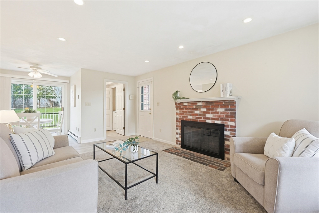 1 Edmund H Nichols Road North Attleboro, MA 02760 - Photo 16 of 39 a living room with furniture a fireplace and a large window
