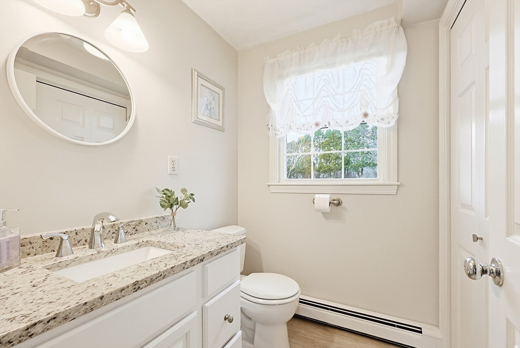 1 Edmund H Nichols Road North Attleboro, MA 02760 - Photo 19 of 39 a bathroom with a granite countertop toilet a sink and a mirror