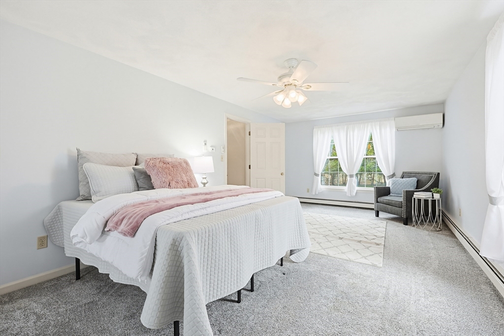 1 Edmund H Nichols Road North Attleboro, MA 02760 - Photo 22 of 39 a spacious bedroom with a bed and a chandelier