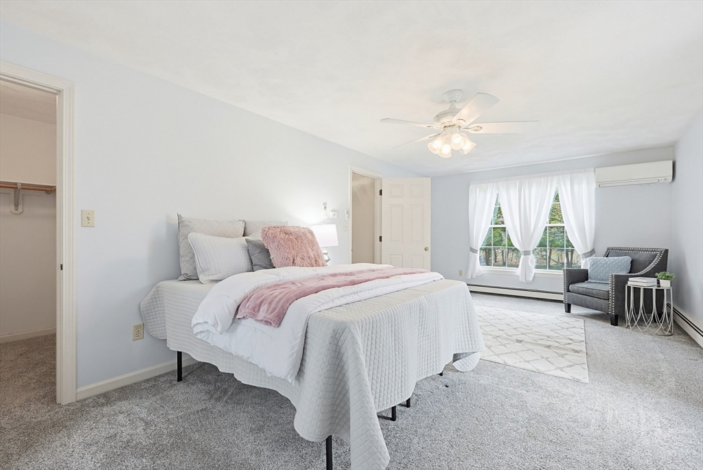 1 Edmund H Nichols Road North Attleboro, MA 02760 - Photo 23 of 39 a spacious bedroom with a bed and a chandelier