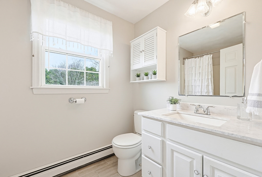 1 Edmund H Nichols Road North Attleboro, MA 02760 - Photo 29 of 39 a bathroom with a granite countertop toilet sink and mirror