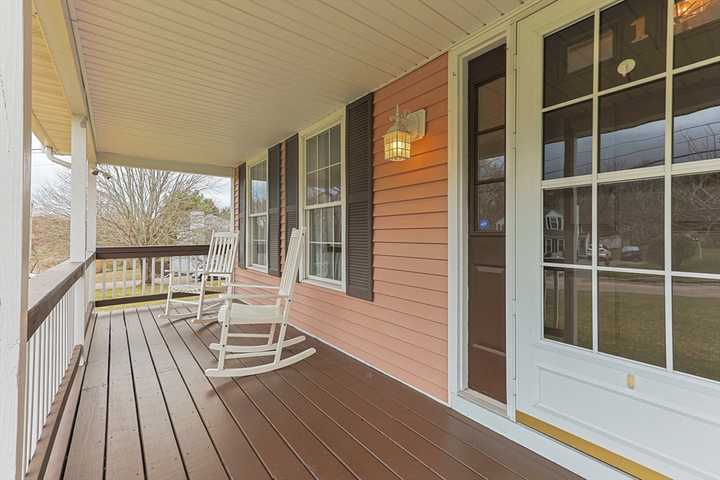 1 Edmund H Nichols Road North Attleboro, MA 02760 - Photo 36 of 39 a porch with a table and chairs next to a window