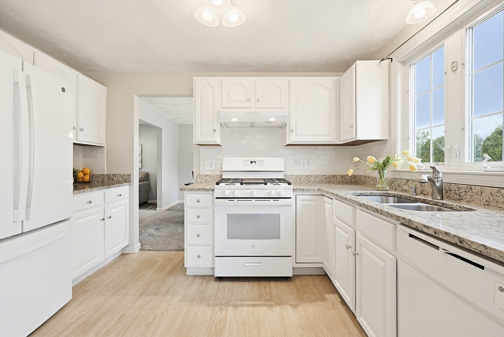 1 Edmund H Nichols Road North Attleboro, MA 02760 - Photo 5 of 39 a kitchen with granite countertop white cabinets and white appliances