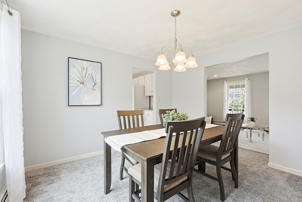 1 Edmund H Nichols Road North Attleboro, MA 02760 - Photo 10 of 39 a view of a dining room with furniture and chandelier