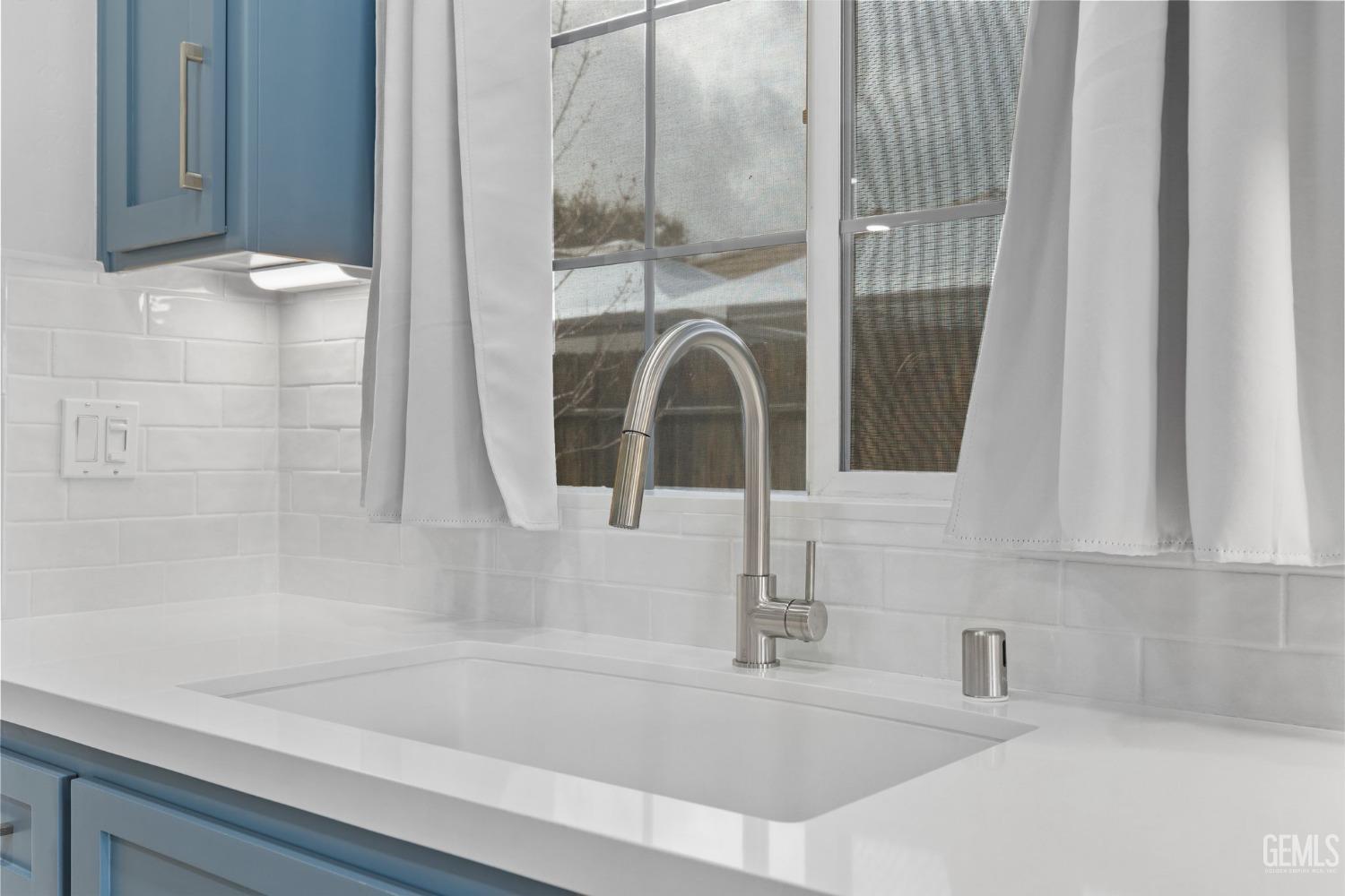 Undisclosed Address Bakersfield, CA 93312 - Photo 12 of 34 a bathroom with a sink and a mirror