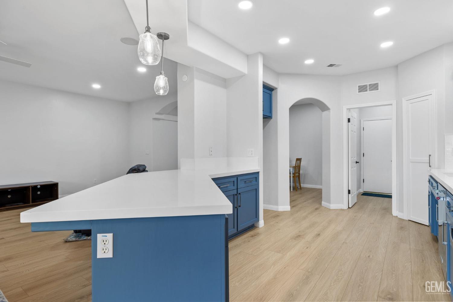 Undisclosed Address Bakersfield, CA 93312 - Photo 14 of 34 a kitchen with stainless steel appliances a refrigerator and a kitchen island
