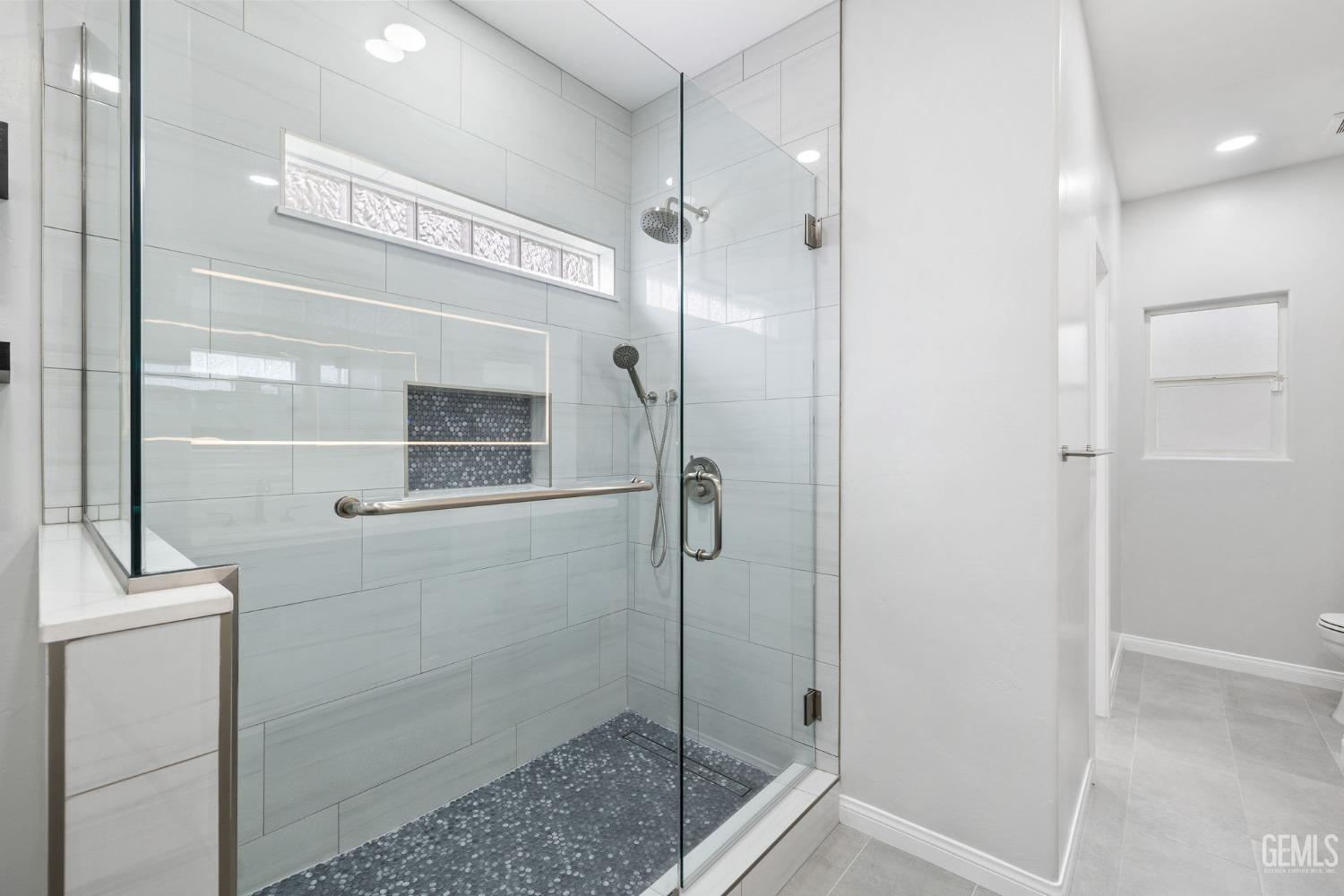 Undisclosed Address Bakersfield, CA 93312 - Photo 21 of 34 a bathroom with a shower