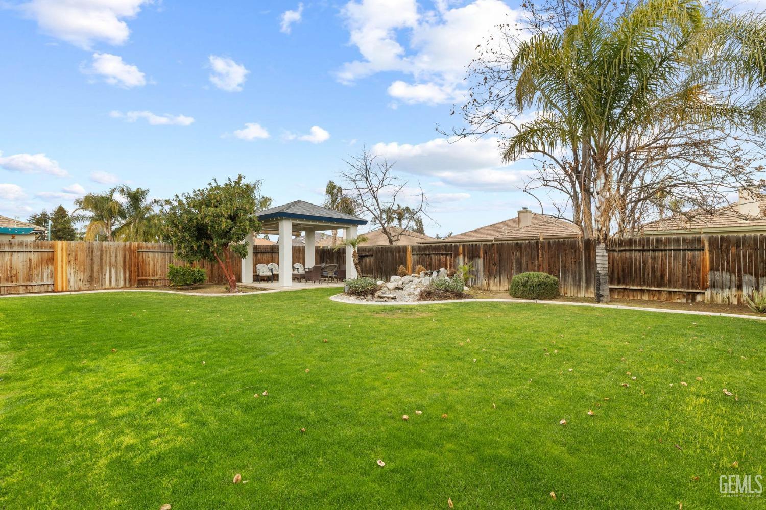 Undisclosed Address Bakersfield, CA 93312 - Photo 26 of 34 a front view of house with yard and seating area
