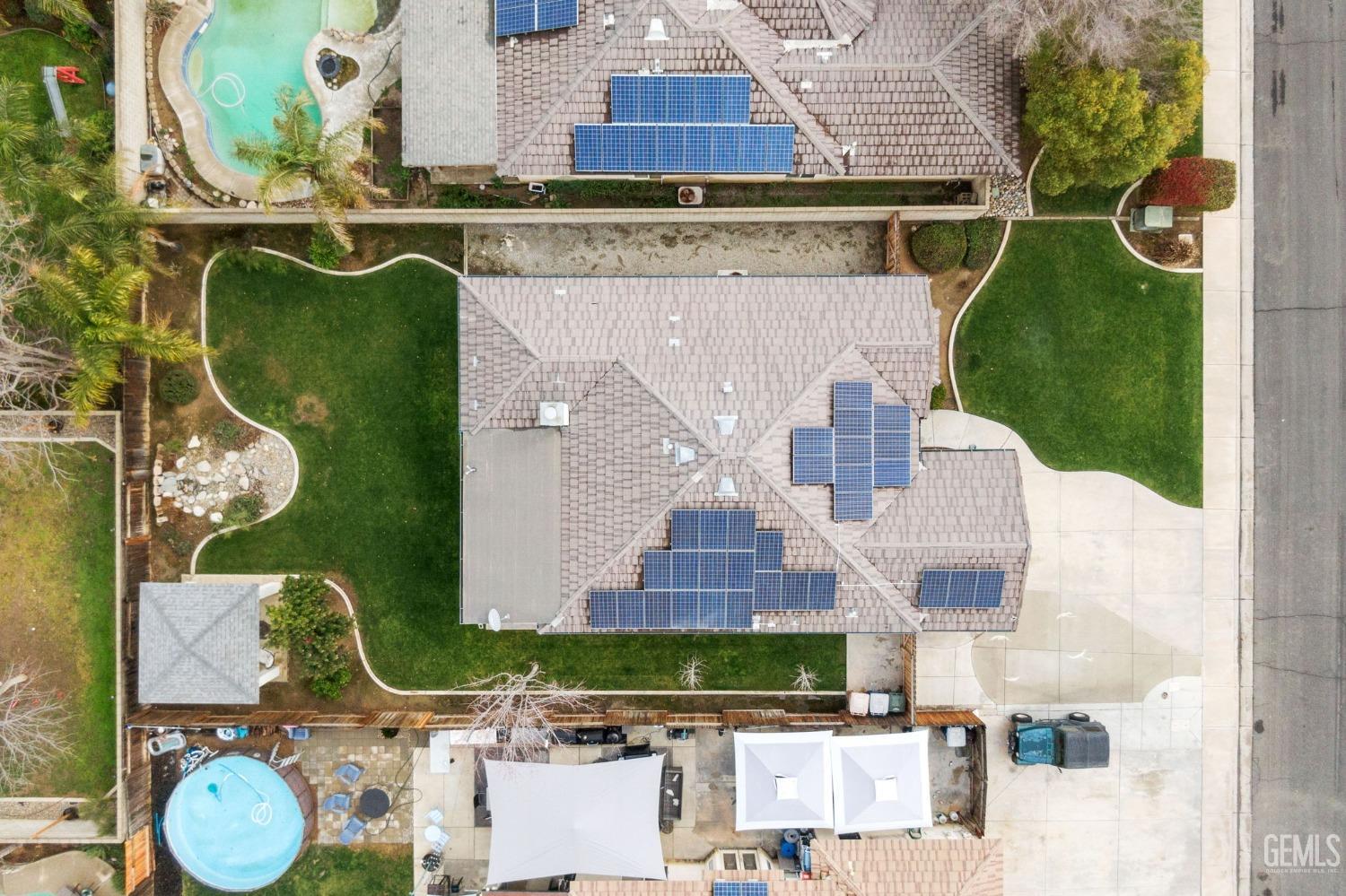 Undisclosed Address Bakersfield, CA 93312 - Photo 31 of 34 an aerial view of a house with garden space and building view