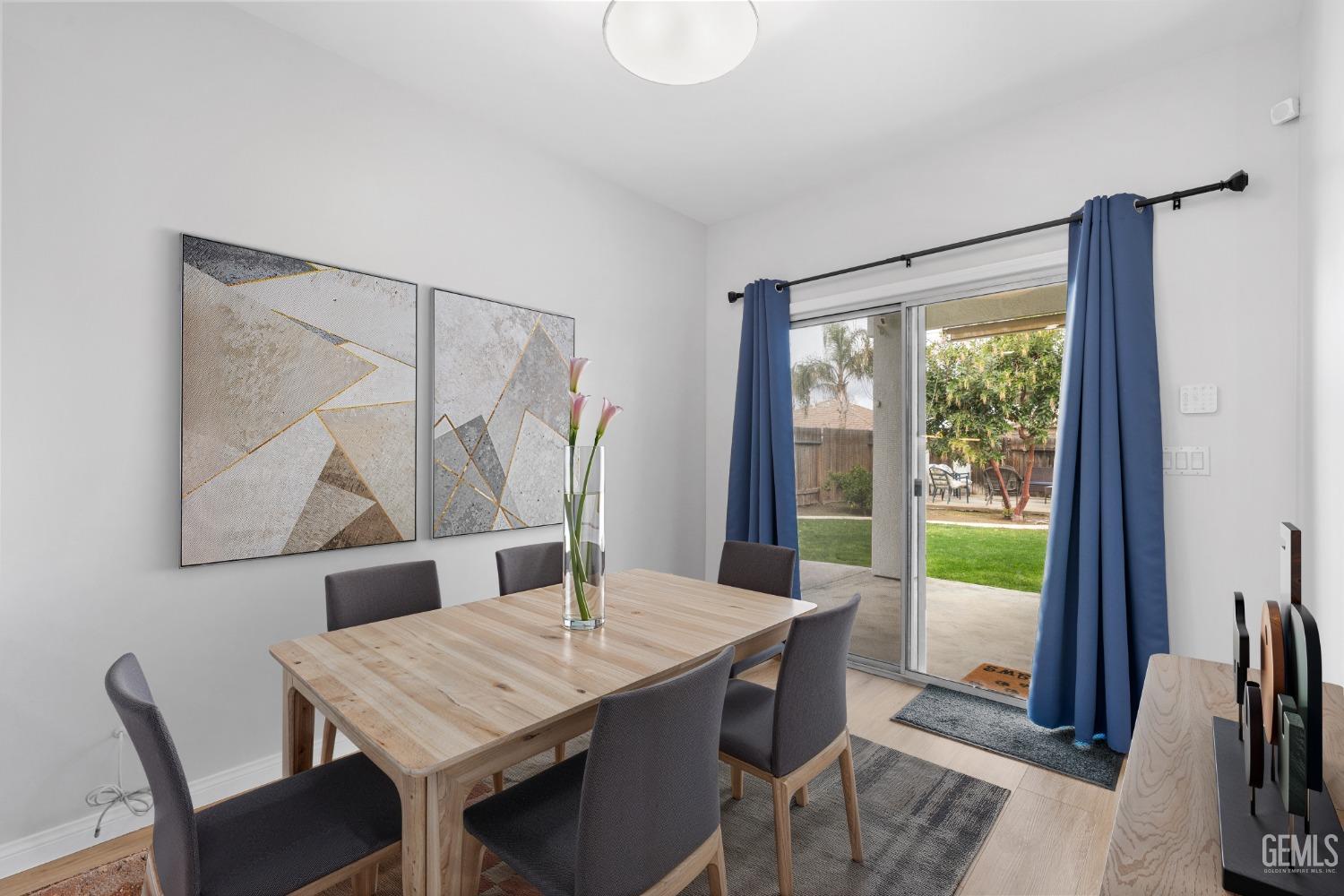 Undisclosed Address Bakersfield, CA 93312 - Photo 33 of 34 a view of a dining room with furniture window and wooden floor