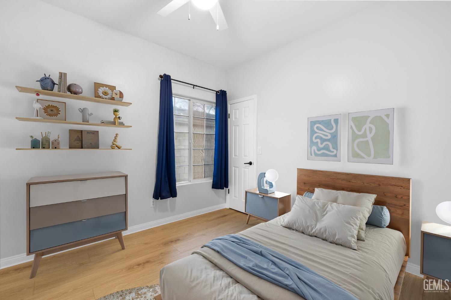 Undisclosed Address Bakersfield, CA 93312 - Photo 34 of 34 a bedroom with a bed and a chandelier