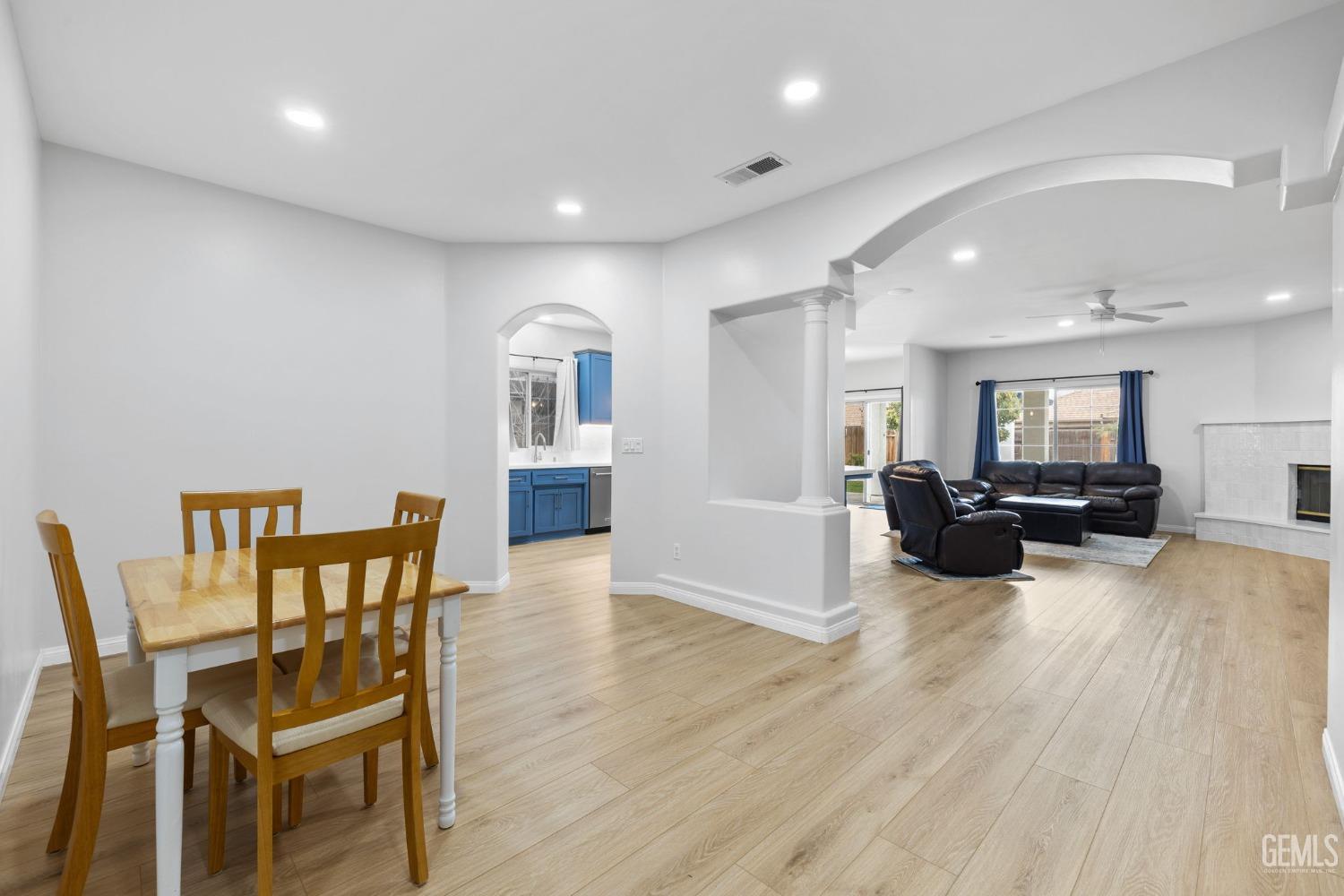 Undisclosed Address Bakersfield, CA 93312 - Photo 4 of 34 a living room with furniture and a wooden floor