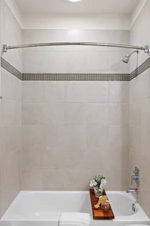 a bathroom with a bath tub and a shower