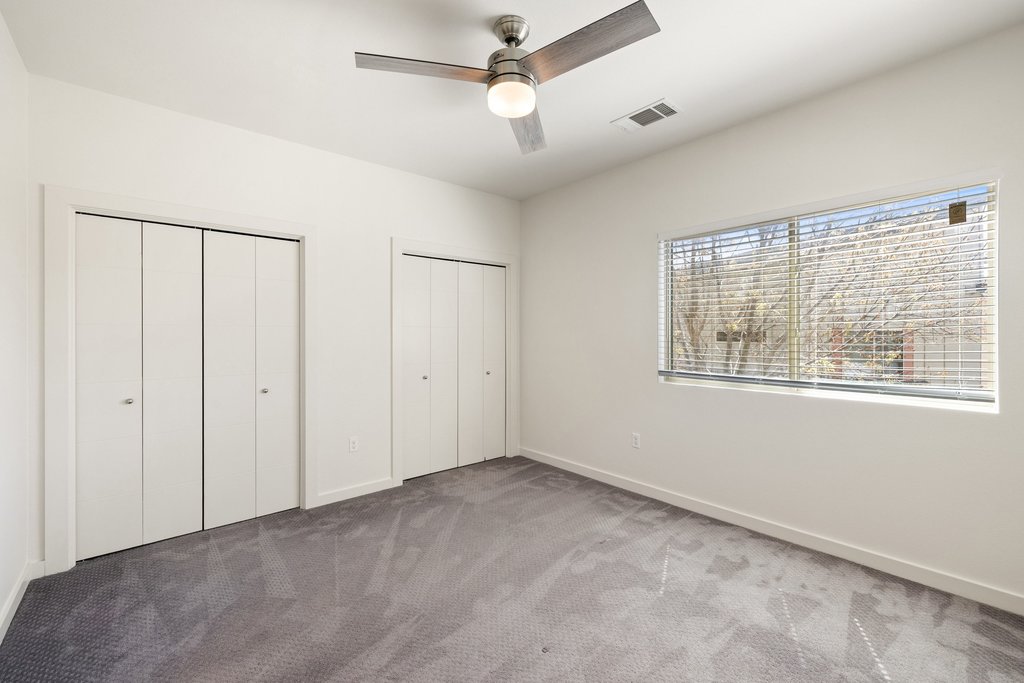 7805 Cooper Lane, Unit 401 Austin, TX 78745 - Photo 18 of 33 Closet space along back wall in bedroom