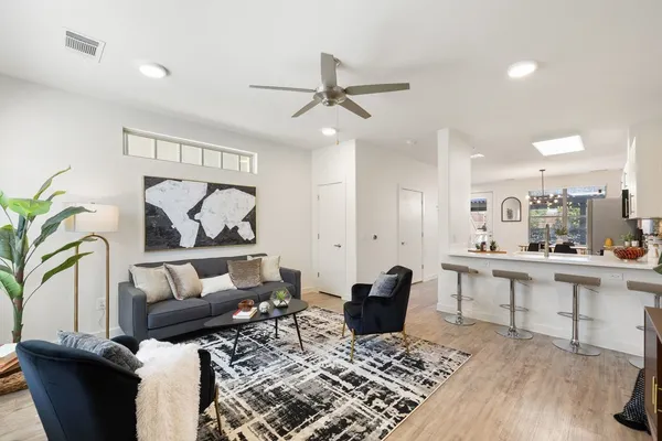 a living room with furniture and a rug