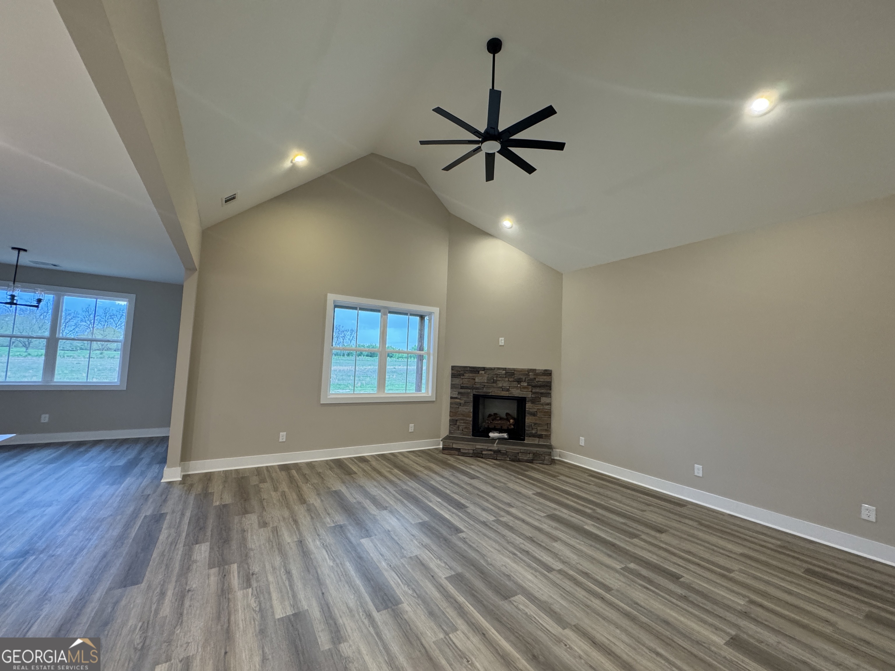 100 Melville Brown Road Williamson, GA 30292 - Photo 8 of 21 wooden floor in an empty room with a window