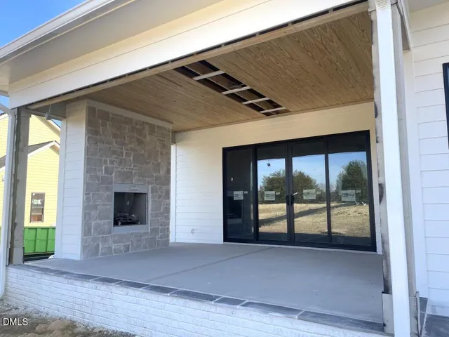 a front view of a house with large yard