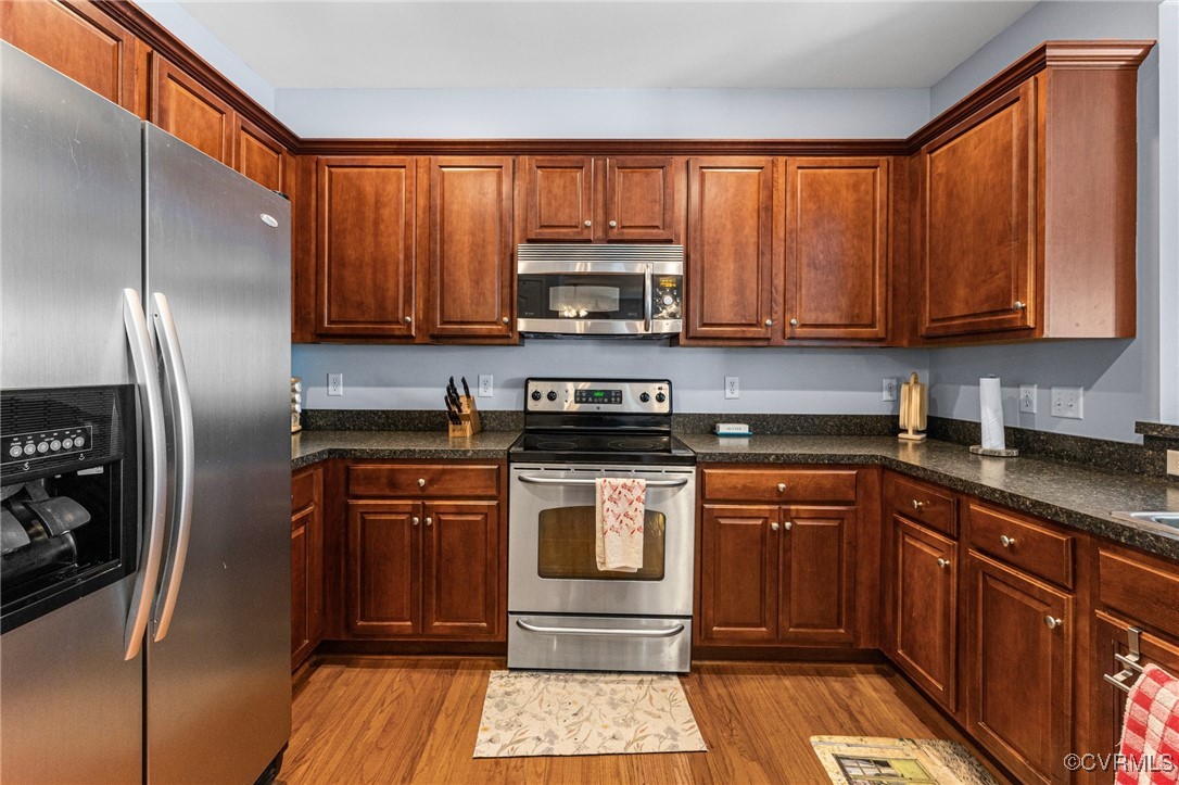 3321 Ceres Road Henrico, VA 23294 - Photo 11 of 38 a kitchen with stainless steel appliances granite countertop a stove a refrigerator and a sink