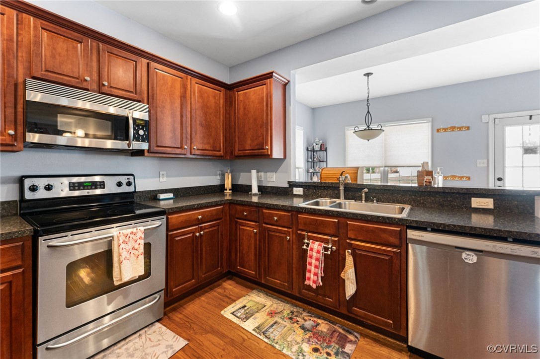 3321 Ceres Road Henrico, VA 23294 - Photo 12 of 38 a kitchen with stainless steel appliances granite countertop a stove sink and cabinets