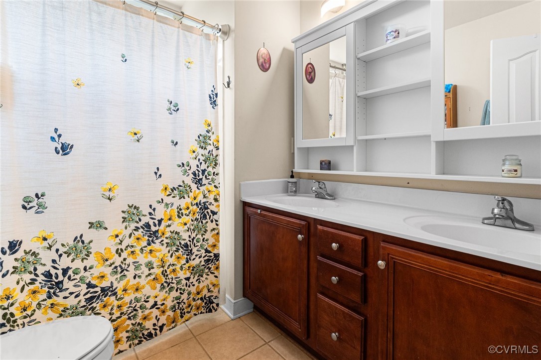 3321 Ceres Road Henrico, VA 23294 - Photo 23 of 38 a bathroom with a sink and a mirror