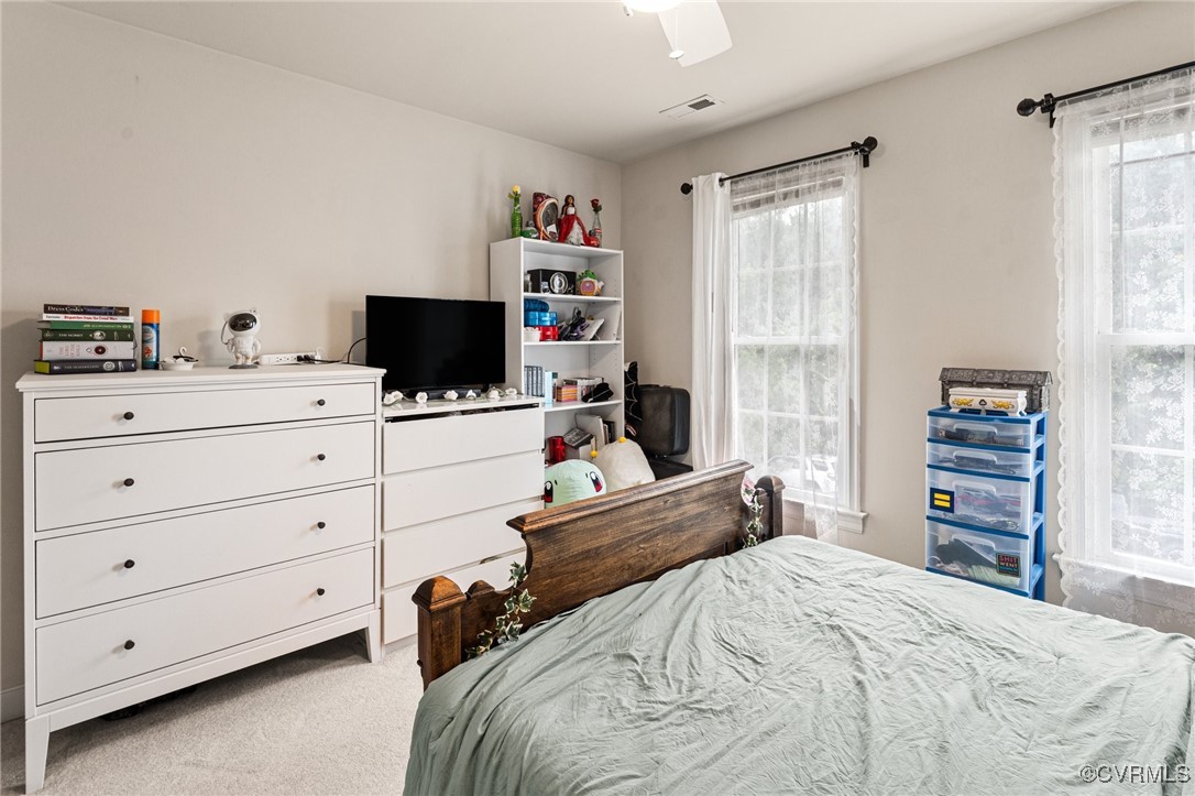 3321 Ceres Road Henrico, VA 23294 - Photo 25 of 38 a bedroom with a bed and a flat tv screen