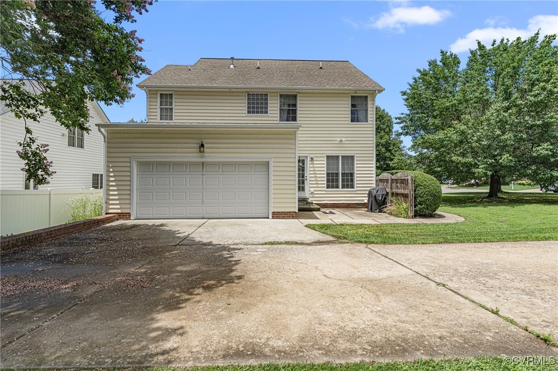 3321 Ceres Road Henrico, VA 23294 - Photo 30 of 38 a front view of a house with a yard and garage
