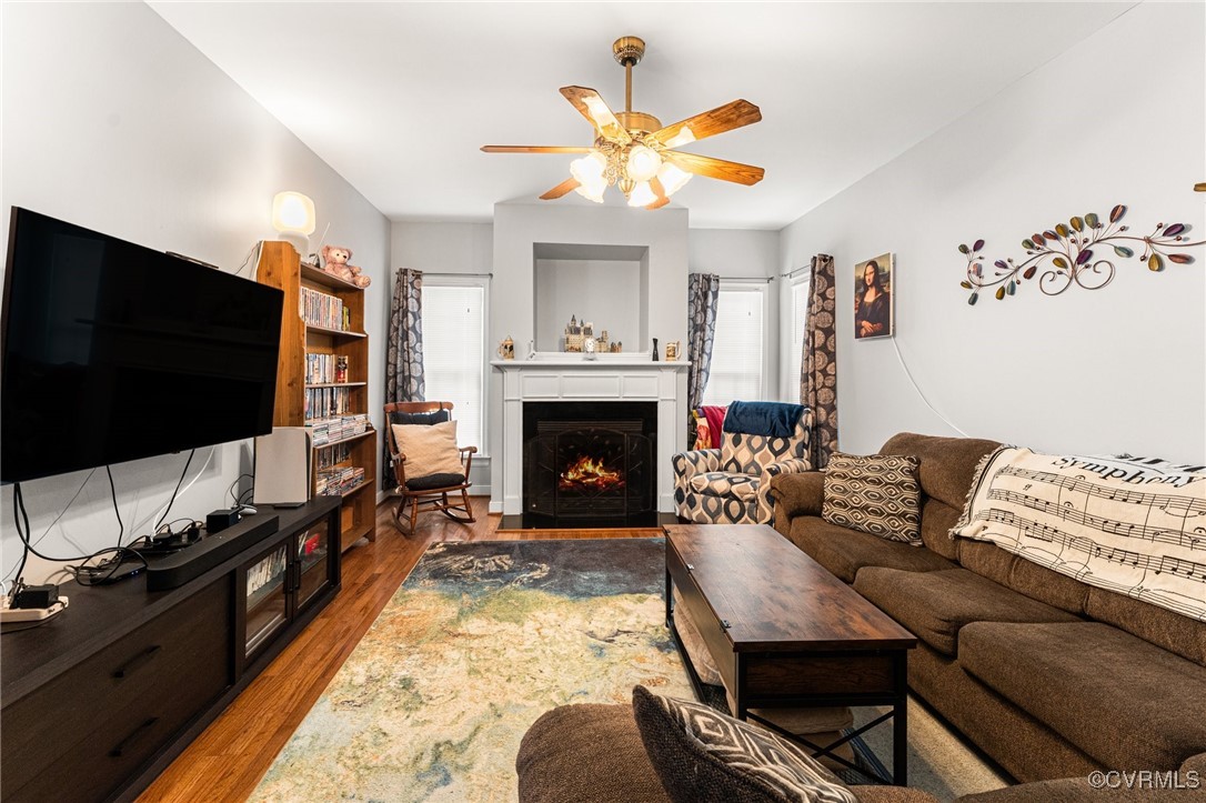 3321 Ceres Road Henrico, VA 23294 - Photo 8 of 38 a living room with furniture a flat screen tv and a fireplace