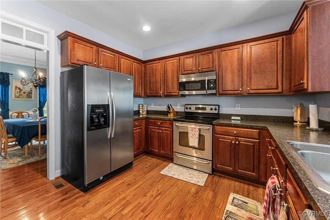 3321 Ceres Road Henrico, VA 23294 - Photo 10 of 38 a kitchen with granite countertop a refrigerator stove top oven and sink