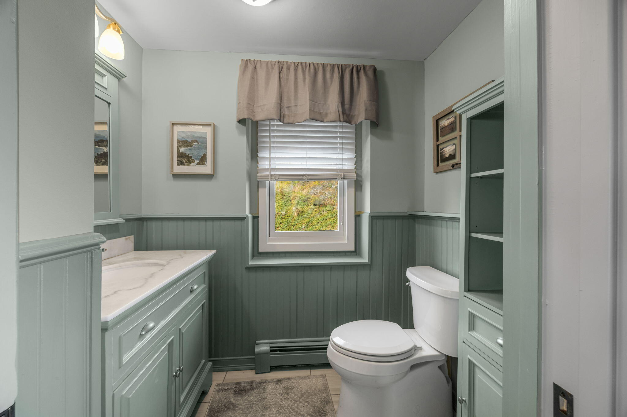 52 Corn Hill Road Truro, MA 02666 - Photo 38 of 74 a bathroom with a granite countertop toilet sink and mirror