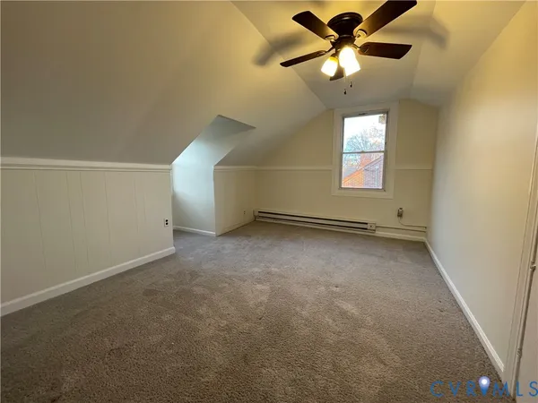 a view of an empty room and a window