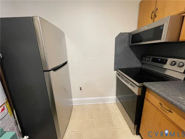 a kitchen with a sink and a stove