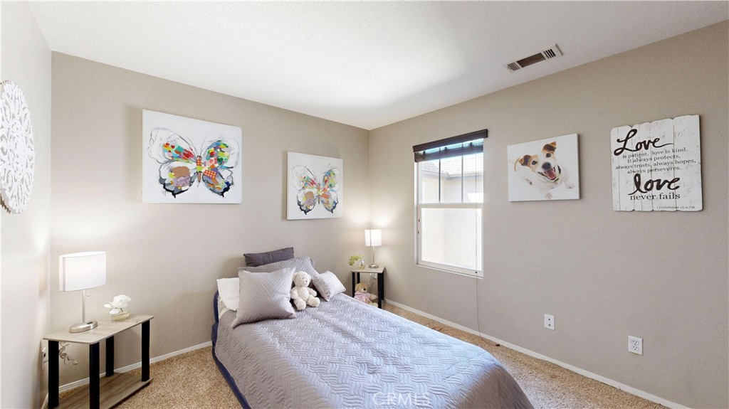 10375 Church Street, Unit 100 Rancho Cucamonga, CA 91730 - Photo 19 of 29 a bedroom with a bed and a window