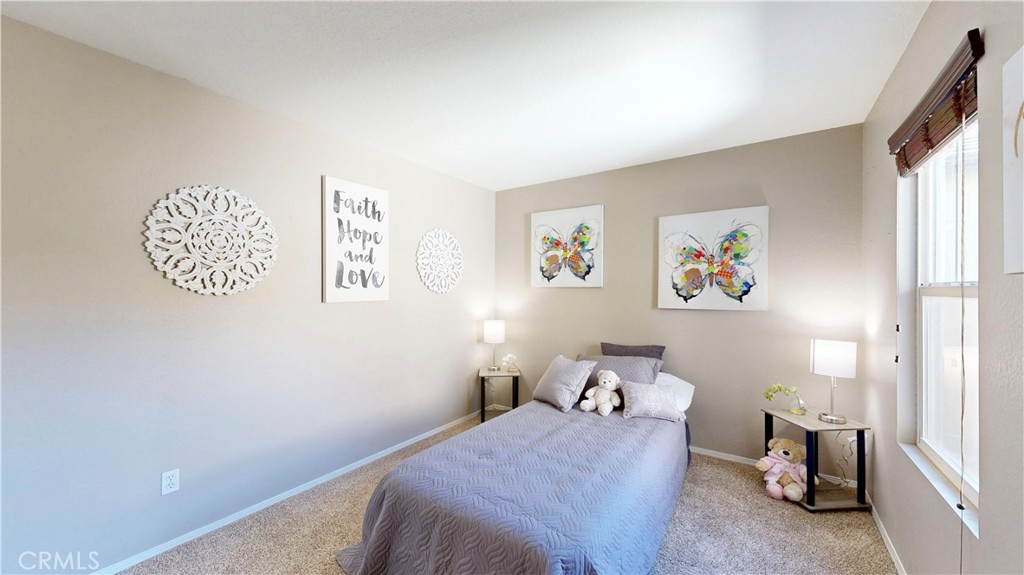 10375 Church Street, Unit 100 Rancho Cucamonga, CA 91730 - Photo 20 of 29 a bedroom with a bed and a window
