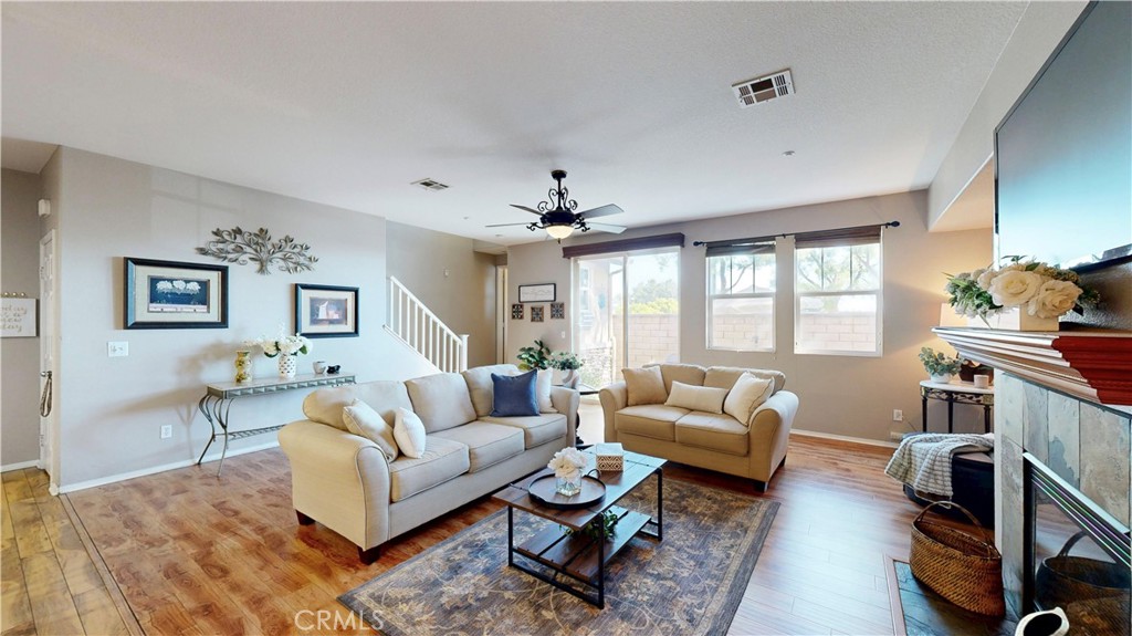 10375 Church Street, Unit 100 Rancho Cucamonga, CA 91730 - Photo 2 of 29 a living room with furniture and a large window